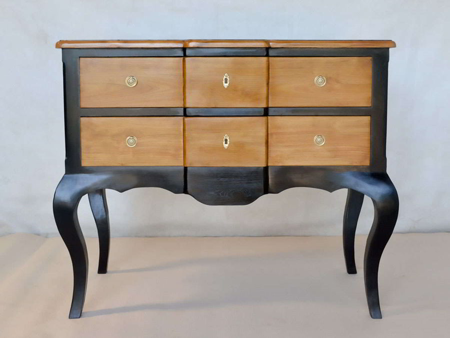 Natural wood front drawers protrude center and accessories detail.