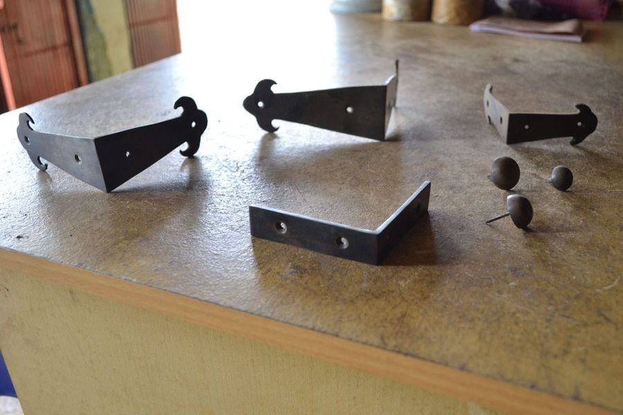 Antique brass accessories on table apron