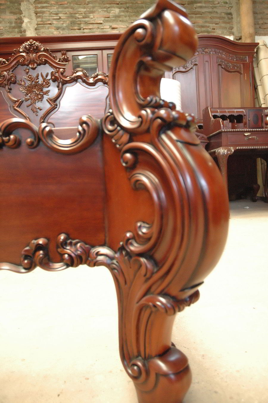 Carving ornament at the headboard bottom frame
