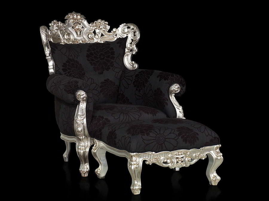 Rococo chair and ottoman in black fabric, silver lef gilt finish.